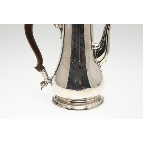 74 - A LATE GEORGE II SILVER COFFEE POT. Of plain baluster form, with scroll handle and round foot, the l... 