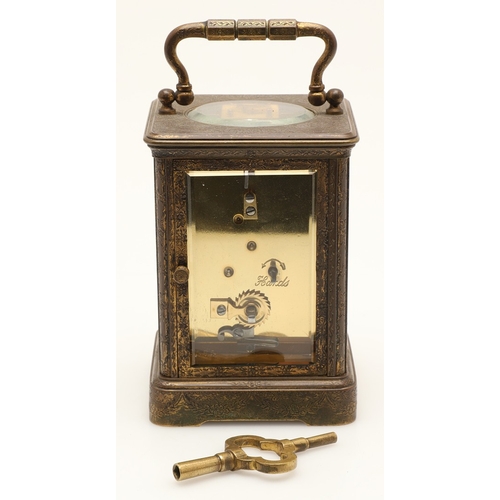 397 - A 19TH CENTURY FRENCH BRASS AND PORCELAIN CARRIAGE CLOCK. the case engraved with foliate detail and ... 