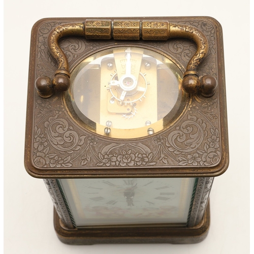 397 - A 19TH CENTURY FRENCH BRASS AND PORCELAIN CARRIAGE CLOCK. the case engraved with foliate detail and ... 