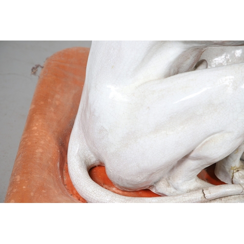 427 - A PAIR OF ITALIAN LIFE-SIZE CRACKLE GLAZE POTTERY GREYHOUNDS AND CUSHION BASES. in seated pose with ... 