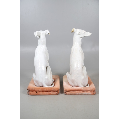 427 - A PAIR OF ITALIAN LIFE-SIZE CRACKLE GLAZE POTTERY GREYHOUNDS AND CUSHION BASES. in seated pose with ... 