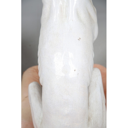 427 - A PAIR OF ITALIAN LIFE-SIZE CRACKLE GLAZE POTTERY GREYHOUNDS AND CUSHION BASES. in seated pose with ... 