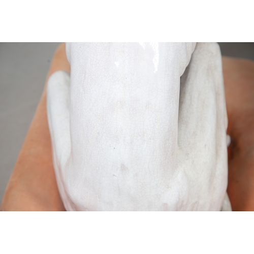 427 - A PAIR OF ITALIAN LIFE-SIZE CRACKLE GLAZE POTTERY GREYHOUNDS AND CUSHION BASES. in seated pose with ... 