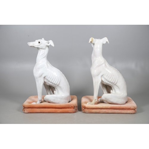 427 - A PAIR OF ITALIAN LIFE-SIZE CRACKLE GLAZE POTTERY GREYHOUNDS AND CUSHION BASES. in seated pose with ... 