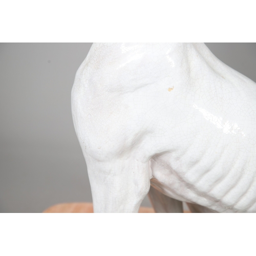 427 - A PAIR OF ITALIAN LIFE-SIZE CRACKLE GLAZE POTTERY GREYHOUNDS AND CUSHION BASES. in seated pose with ... 