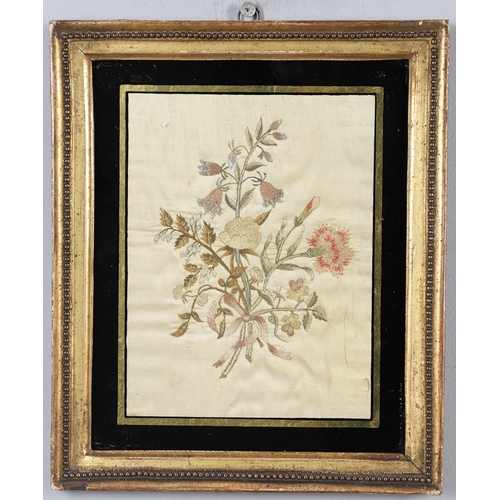 434 - A REGENCY OVAL SILKWORK FLORAL PICTURE. depicting a basket of flowers within a gilded frame, 39cm x ... 