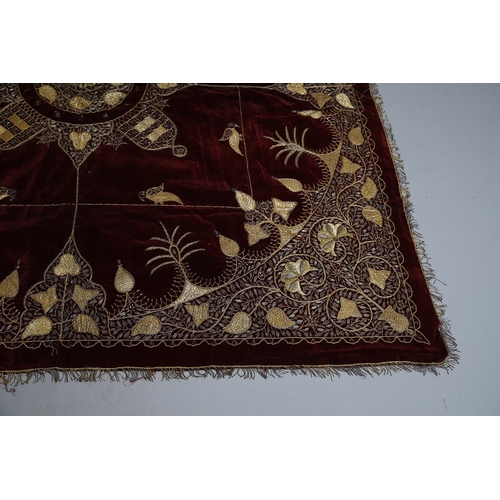 439 - A 19TH CENTURY TURKISH LONG THREAD TABLECLOTH. the embroidered bird and foliate design in gold metal... 
