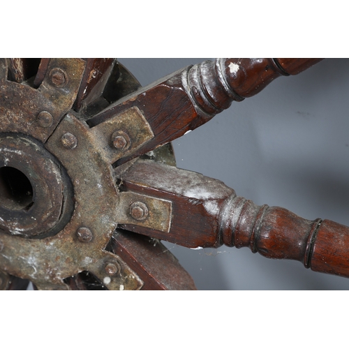 444 - A LARGE MAHOGANY AND BRASS BOUND SHIP'S WHEEL. unattributed, set with two half pennys, dated 1952, 1... 