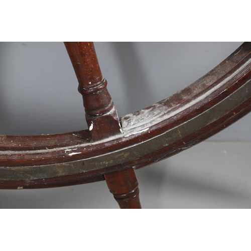 444 - A LARGE MAHOGANY AND BRASS BOUND SHIP'S WHEEL. unattributed, set with two half pennys, dated 1952, 1... 