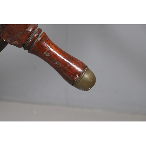 444 - A LARGE MAHOGANY AND BRASS BOUND SHIP'S WHEEL. unattributed, set with two half pennys, dated 1952, 1... 