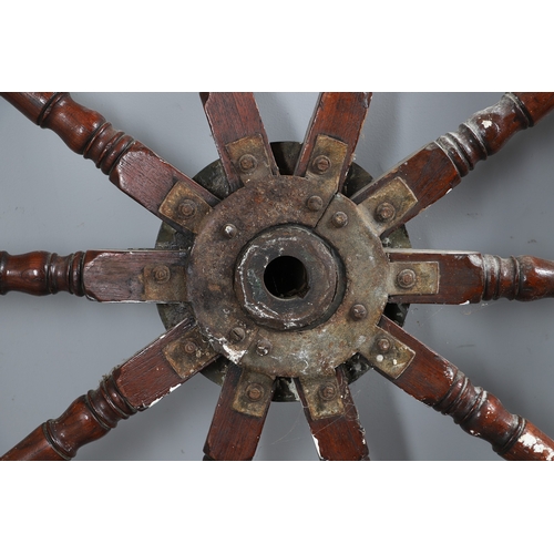 444 - A LARGE MAHOGANY AND BRASS BOUND SHIP'S WHEEL. unattributed, set with two half pennys, dated 1952, 1... 