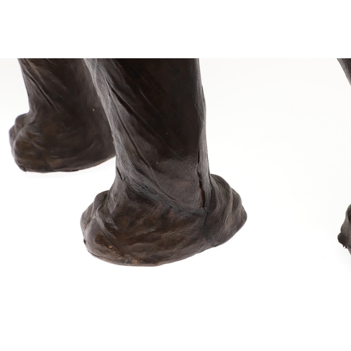 446 - A LARGE LEATHER COVERED ELEPHANT, IN THE STYLE OF OMERSA FOR LIBERTY. with moveable soft leather ear... 