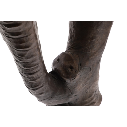 446 - A LARGE LEATHER COVERED ELEPHANT, IN THE STYLE OF OMERSA FOR LIBERTY. with moveable soft leather ear... 