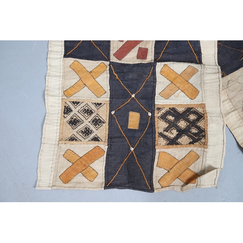 450 - TWO KUBA TEXTILE PANELS (CONGALESE, 20/21ST CENTURY). woven and dyed rafia palm, both embellished wi... 