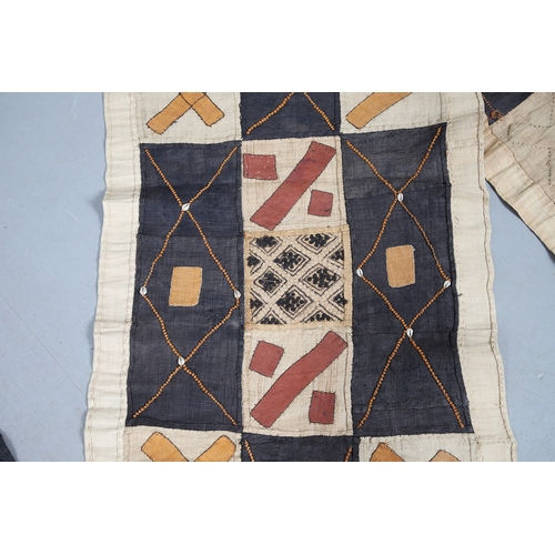 450 - TWO KUBA TEXTILE PANELS (CONGALESE, 20/21ST CENTURY). woven and dyed rafia palm, both embellished wi... 