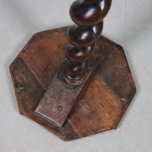 468 - AN 18TH CENTURY WALNUT CANDLESTAND (MARRIAGE). the octagonal oyster veneered to a spiral column and ... 