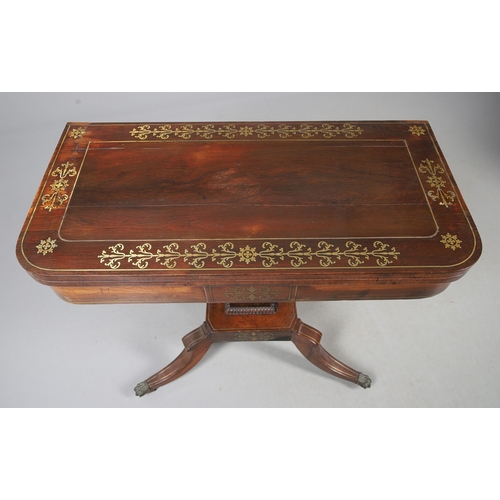 475 - A PAIR OF REGENCY ROSEWOOD AND BRASS INLAID GAMES TABLES. with D-end baize lined swivel tops, inlaid... 