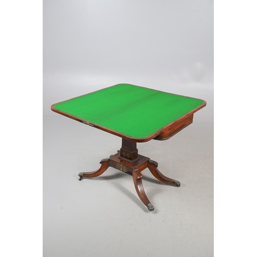 475 - A PAIR OF REGENCY ROSEWOOD AND BRASS INLAID GAMES TABLES. with D-end baize lined swivel tops, inlaid... 