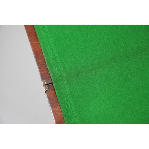 475 - A PAIR OF REGENCY ROSEWOOD AND BRASS INLAID GAMES TABLES. with D-end baize lined swivel tops, inlaid... 