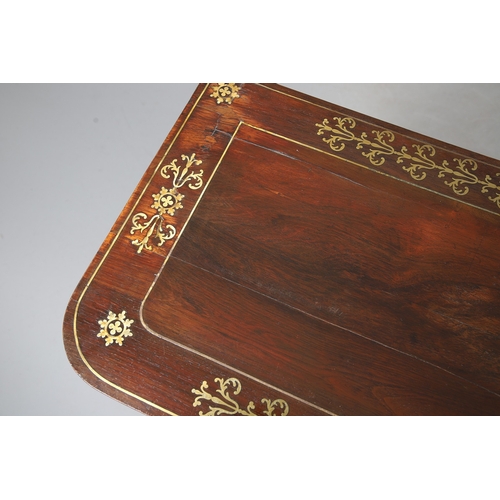 475 - A PAIR OF REGENCY ROSEWOOD AND BRASS INLAID GAMES TABLES. with D-end baize lined swivel tops, inlaid... 
