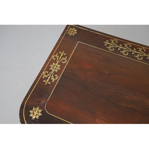 475 - A PAIR OF REGENCY ROSEWOOD AND BRASS INLAID GAMES TABLES. with D-end baize lined swivel tops, inlaid... 