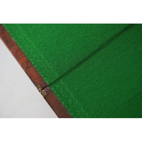 475 - A PAIR OF REGENCY ROSEWOOD AND BRASS INLAID GAMES TABLES. with D-end baize lined swivel tops, inlaid... 