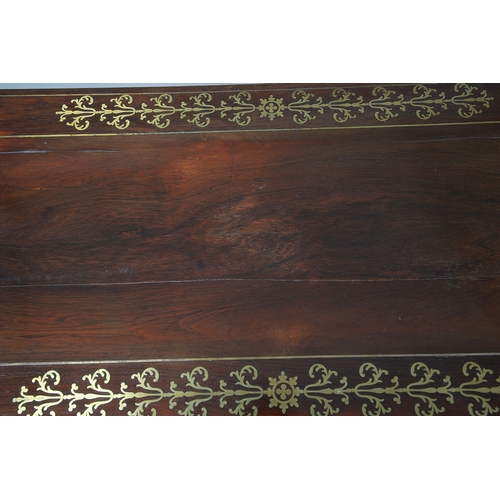 475 - A PAIR OF REGENCY ROSEWOOD AND BRASS INLAID GAMES TABLES. with D-end baize lined swivel tops, inlaid... 