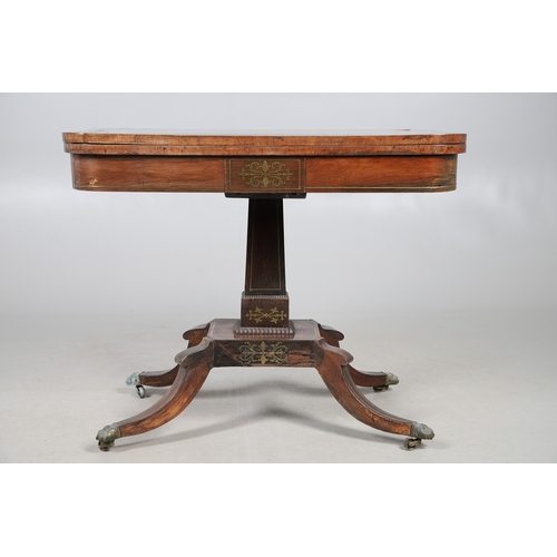 475 - A PAIR OF REGENCY ROSEWOOD AND BRASS INLAID GAMES TABLES. with D-end baize lined swivel tops, inlaid... 