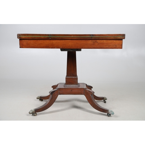 475 - A PAIR OF REGENCY ROSEWOOD AND BRASS INLAID GAMES TABLES. with D-end baize lined swivel tops, inlaid... 