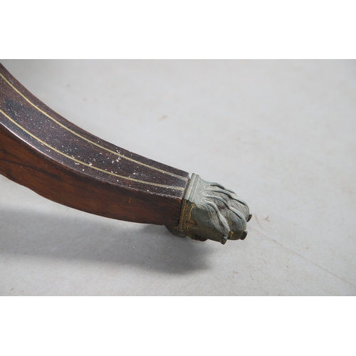 475 - A PAIR OF REGENCY ROSEWOOD AND BRASS INLAID GAMES TABLES. with D-end baize lined swivel tops, inlaid... 