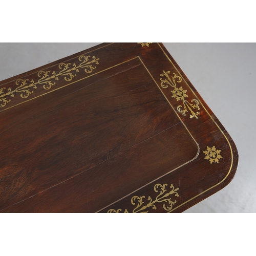 475 - A PAIR OF REGENCY ROSEWOOD AND BRASS INLAID GAMES TABLES. with D-end baize lined swivel tops, inlaid... 