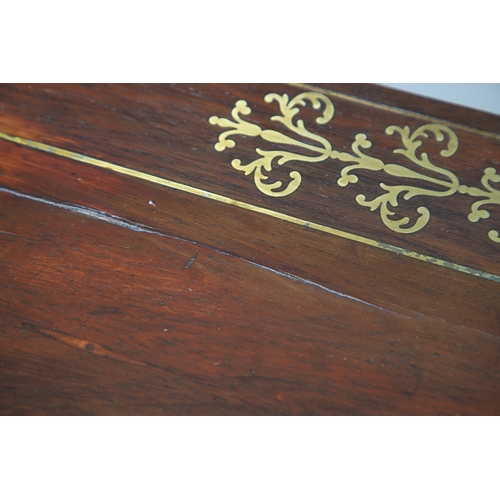 475 - A PAIR OF REGENCY ROSEWOOD AND BRASS INLAID GAMES TABLES. with D-end baize lined swivel tops, inlaid... 