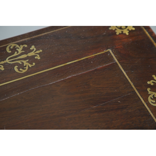 475 - A PAIR OF REGENCY ROSEWOOD AND BRASS INLAID GAMES TABLES. with D-end baize lined swivel tops, inlaid... 
