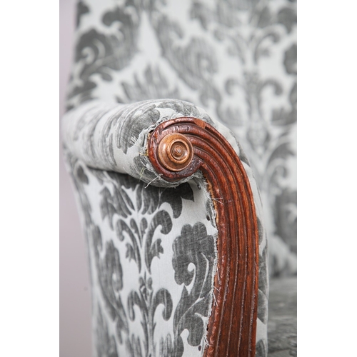 476 - A WILLIAM IV GILLOWS STYLE MAHOGANY LIBRARY CHAIR. the concave back to overstuffed arms, carved reed... 