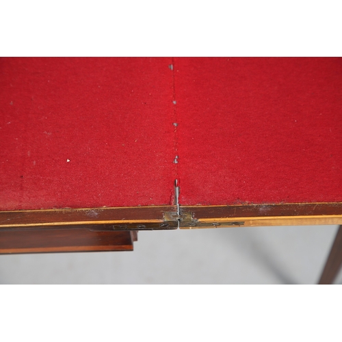 483 - A PAIR OF EDWARDIAN SHERATON STYLE MAHOGANY CARD TABLES. the canted rectangular tops crossbanded wit... 