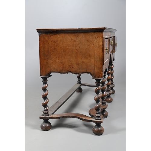 492 - AN 18TH CENTURY STYLE WALNUT DRESSER BASE. constructed from old timbers, the feather banded top with... 