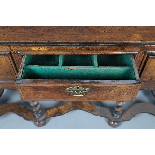 492 - AN 18TH CENTURY STYLE WALNUT DRESSER BASE. constructed from old timbers, the feather banded top with... 
