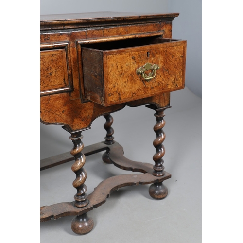 492 - AN 18TH CENTURY STYLE WALNUT DRESSER BASE. constructed from old timbers, the feather banded top with... 