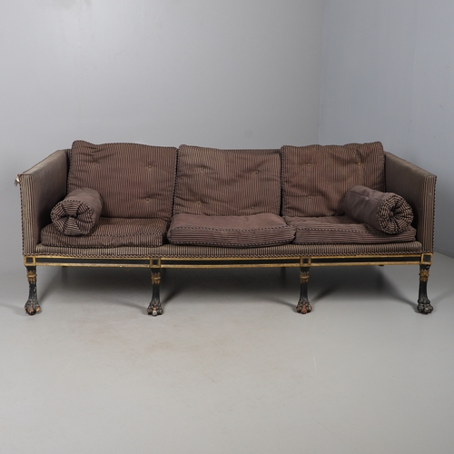 493 - A REGENCY EBONISED AND GILT FRAME THREE SEAT SETTEE IN THE MANNER OF GEORGE BULLOCK. upon eight ebon... 