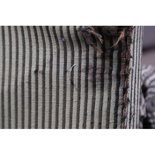 493 - A REGENCY EBONISED AND GILT FRAME THREE SEAT SETTEE IN THE MANNER OF GEORGE BULLOCK. upon eight ebon... 