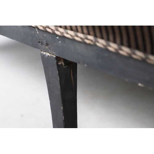 493 - A REGENCY EBONISED AND GILT FRAME THREE SEAT SETTEE IN THE MANNER OF GEORGE BULLOCK. upon eight ebon... 