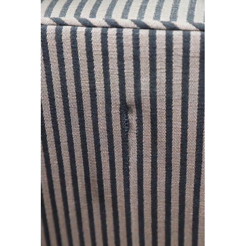 493 - A REGENCY EBONISED AND GILT FRAME THREE SEAT SETTEE IN THE MANNER OF GEORGE BULLOCK. upon eight ebon... 