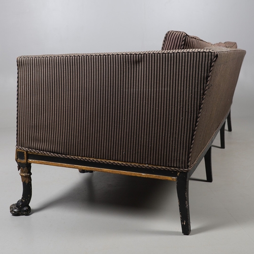 493 - A REGENCY EBONISED AND GILT FRAME THREE SEAT SETTEE IN THE MANNER OF GEORGE BULLOCK. upon eight ebon... 