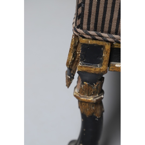 493 - A REGENCY EBONISED AND GILT FRAME THREE SEAT SETTEE IN THE MANNER OF GEORGE BULLOCK. upon eight ebon... 