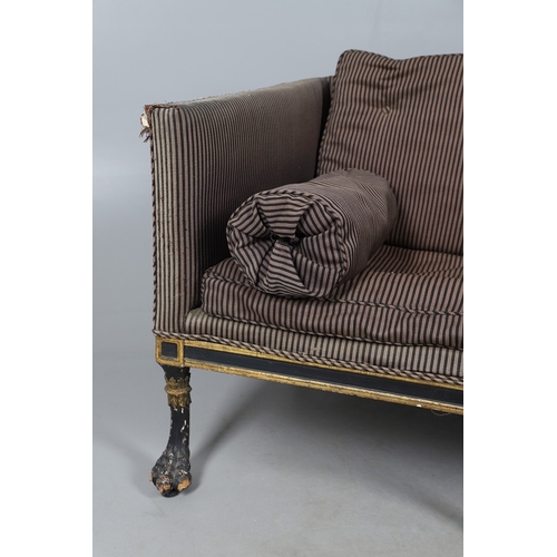 493 - A REGENCY EBONISED AND GILT FRAME THREE SEAT SETTEE IN THE MANNER OF GEORGE BULLOCK. upon eight ebon... 