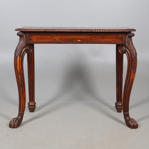 502 - A REGENCY YEW WOOD SIDE TABLE. the shaped top with canted corners and half beaded border, above acan... 