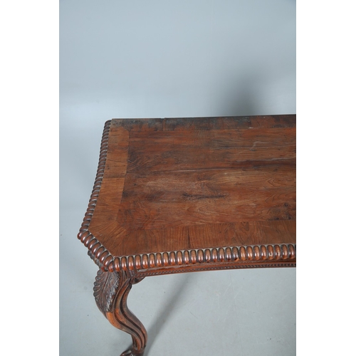 502 - A REGENCY YEW WOOD SIDE TABLE. the shaped top with canted corners and half beaded border, above acan... 