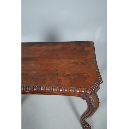 502 - A REGENCY YEW WOOD SIDE TABLE. the shaped top with canted corners and half beaded border, above acan... 