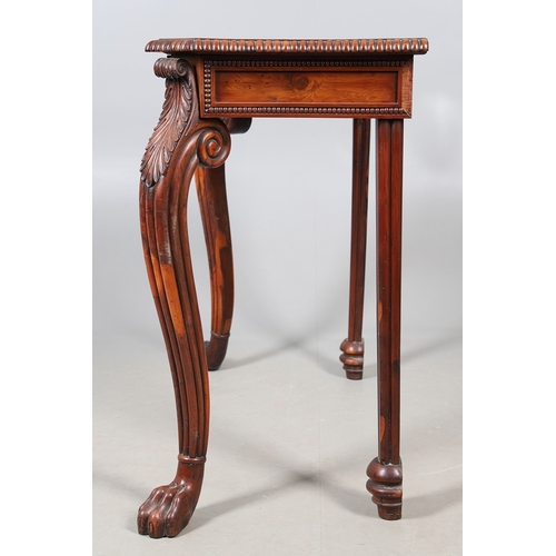 502 - A REGENCY YEW WOOD SIDE TABLE. the shaped top with canted corners and half beaded border, above acan... 