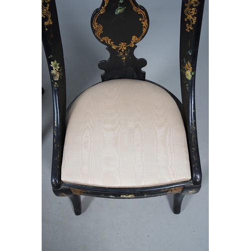 503 - A PAIR OF 19TH CENTURY EBONISED, GILT AND PAINTED CHAIRS. the curved paper mache backs painted with ... 